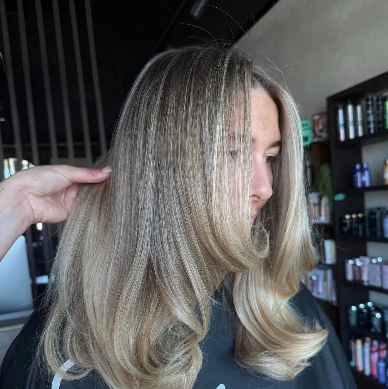 Soft ash blonde lob with a blended root and dimension through the lengths, the finish grey blending is designed to give, at Jenna Ellen Hair