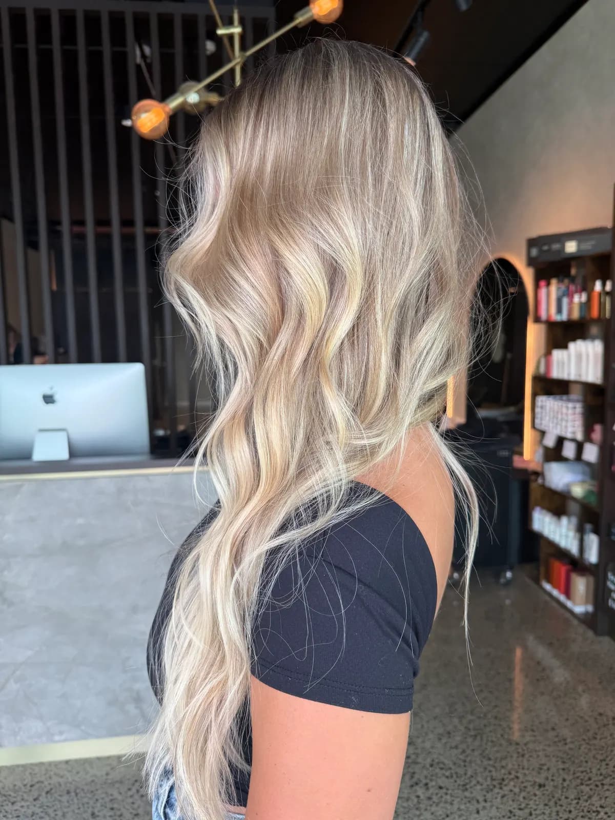 Long bright blonde waves after a cut and blow-dry